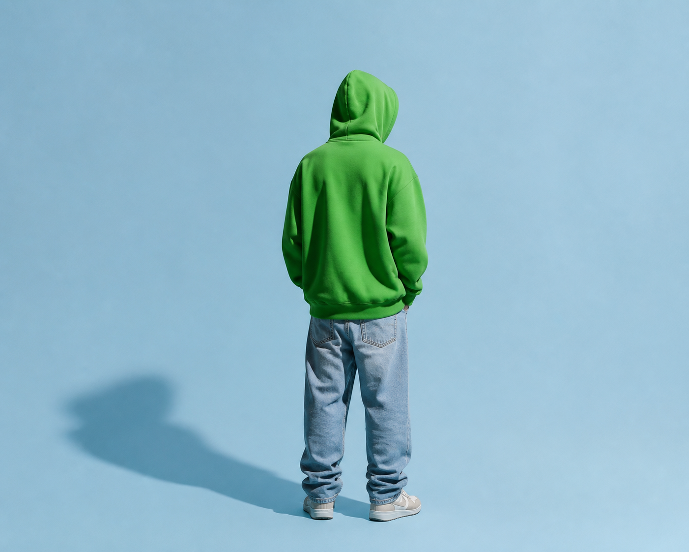 Form and Field — green hoodie against pale blue backdrop