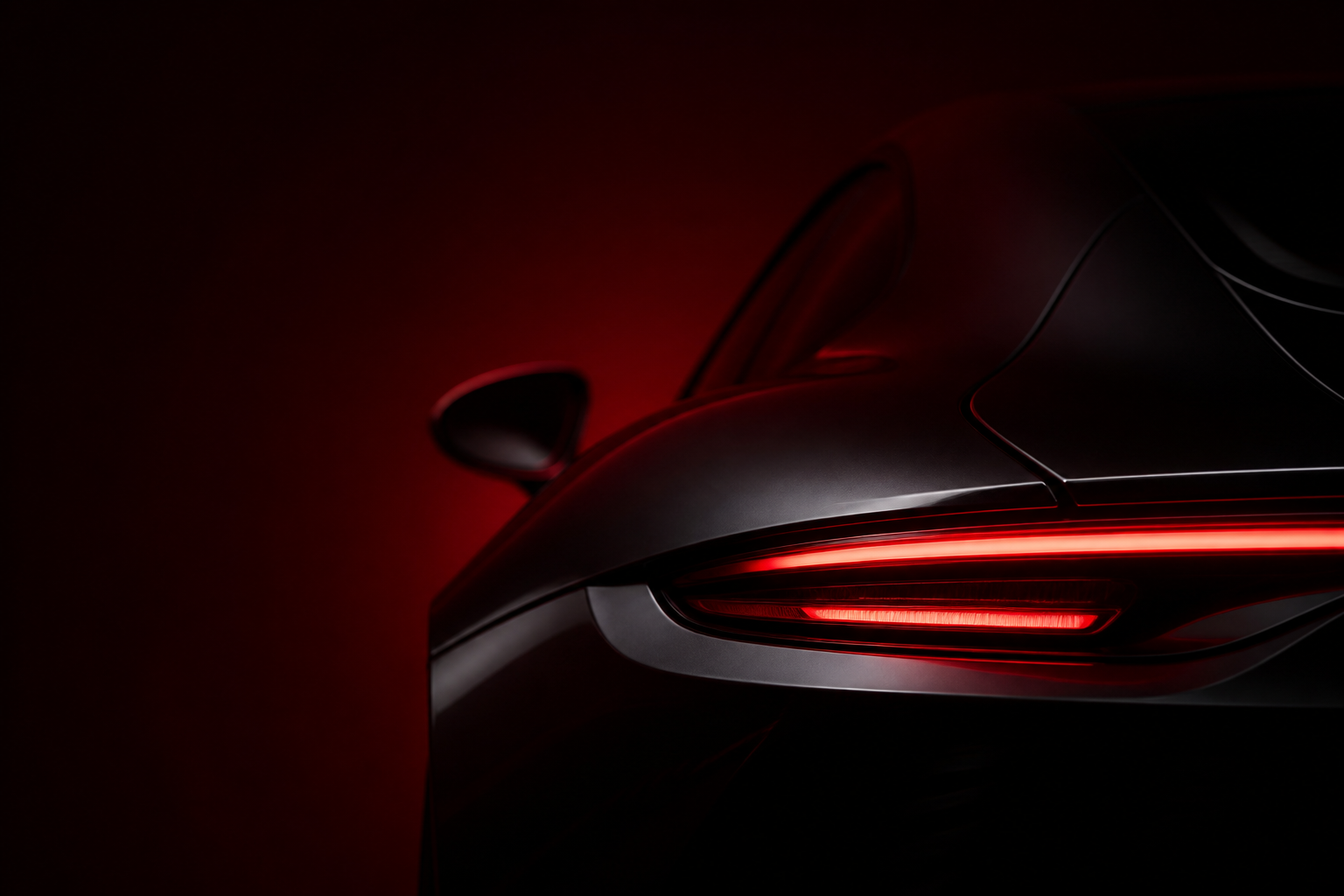 Atelier Vanta — dark sports car rear, burgundy studio glow